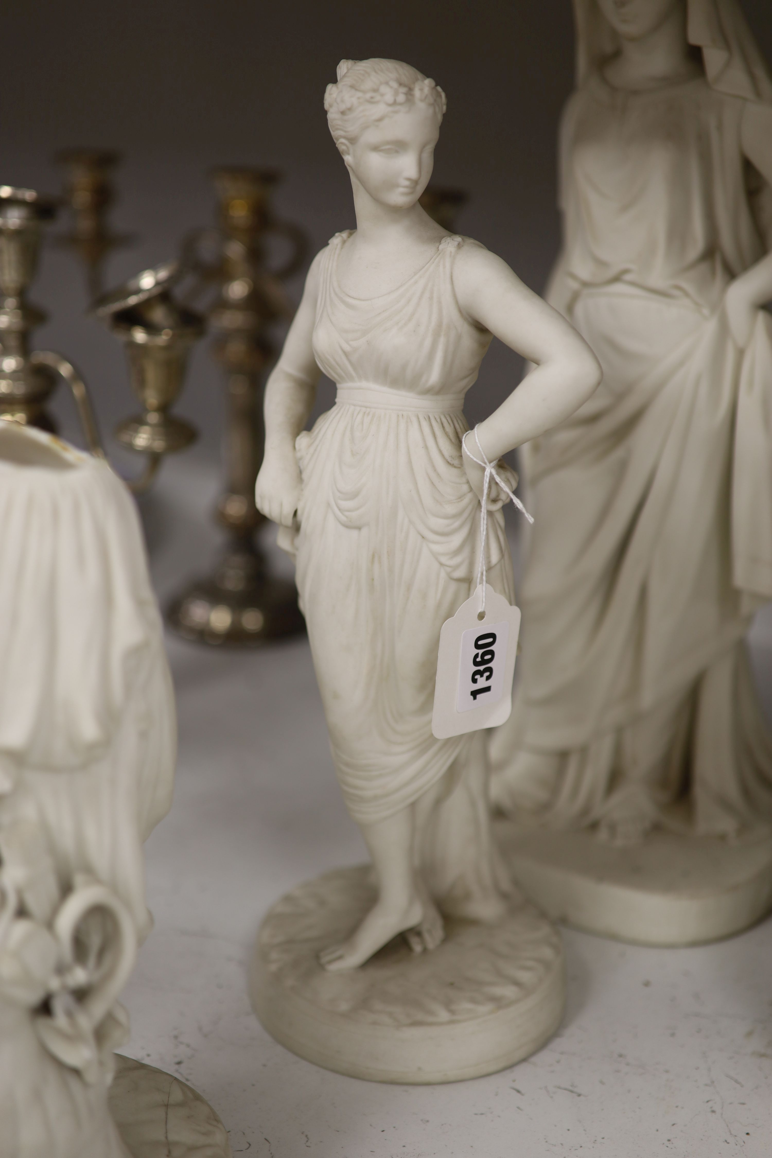 Two Minton parian figures of classical maidens and a similar Worcester figure, tallest 43cm (a.f.)